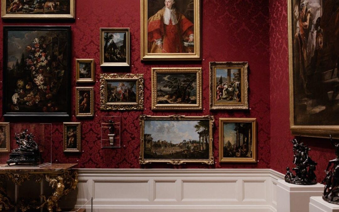 Free Discover classic art in an elegantly designed gallery space with red ornate walls. Stock Photo